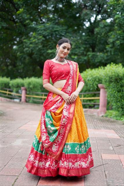 Ekta bandhni Dola Silk Orange Party wear lehenga choli exporter in Gujarat